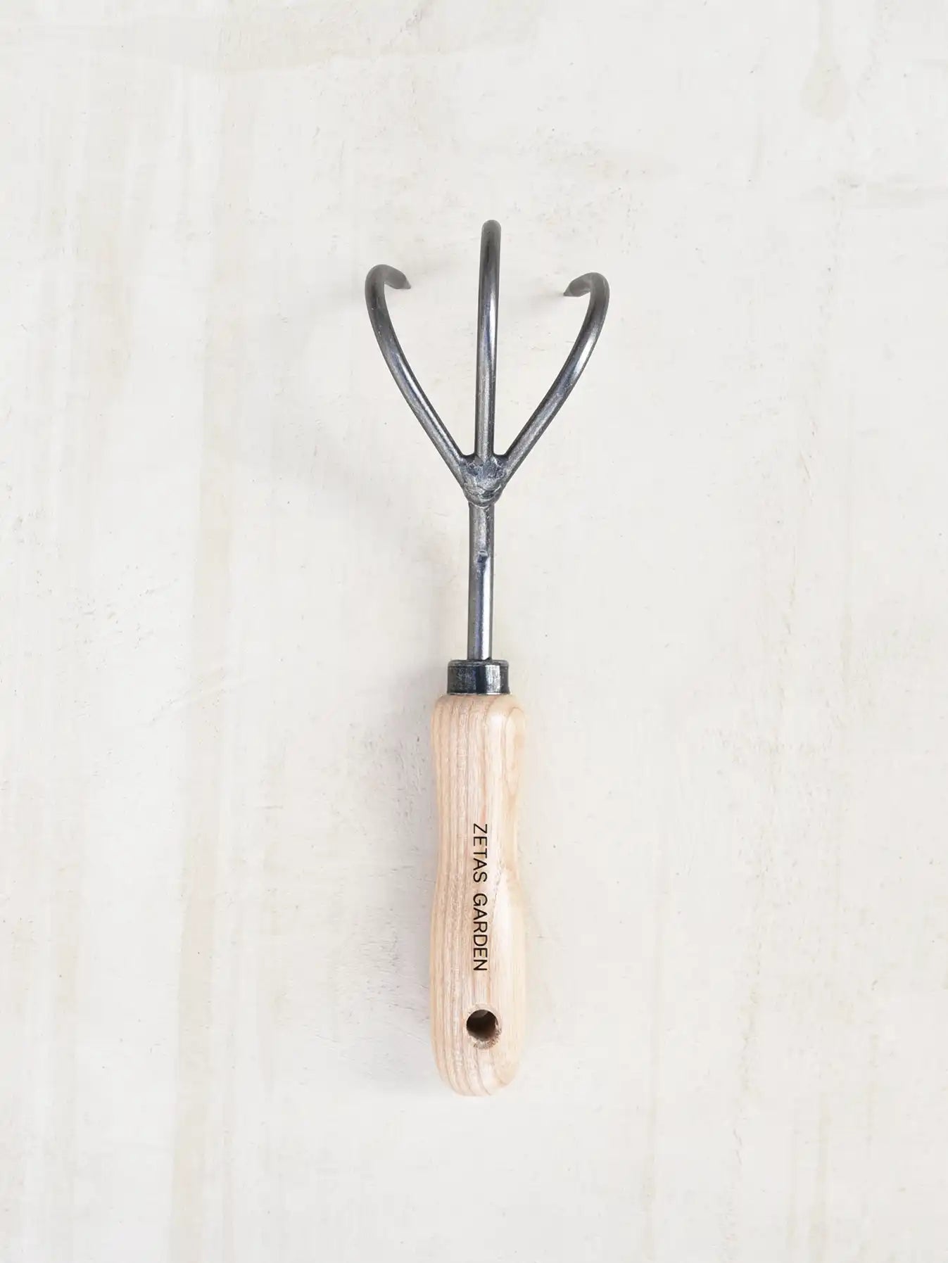 Three-pronged garden cultivator made of Swedish steel and wood - product image.